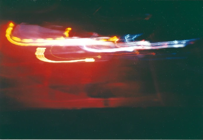 a blurry photo of a street light at night